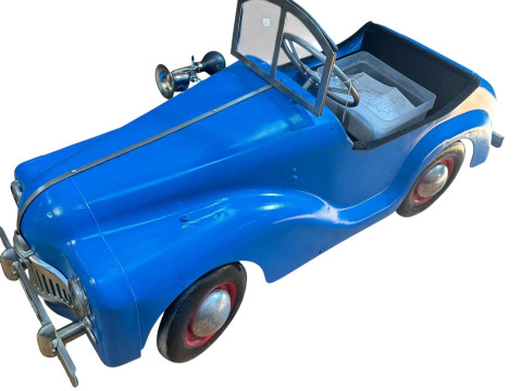 Triang pedal car with battery power.