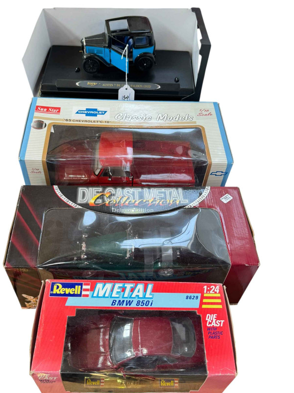 Four boxed Diecast vehicles including Revell, Sunstar, Ricko etc.