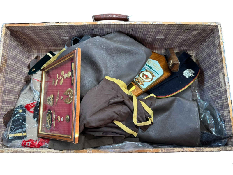 Two trunks of military uniforms, trench art, wall plaque etc.