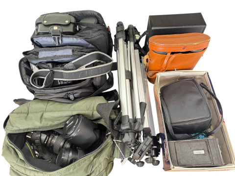 Collection of cameras, binoculars and lenses including Nikon D40, Nikon...