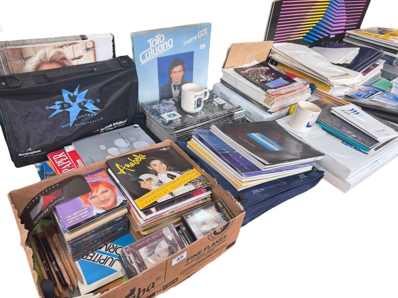 Large collection of Eurovision memorabilia, dating 1980's to 1990's, including programmes, singles, records, cups etc.