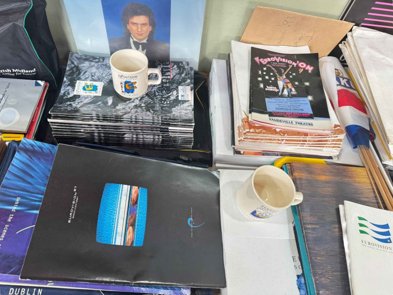 Large collection of Eurovision memorabilia, dating 1980's to 1990's, including programmes, singles, records, cups etc.