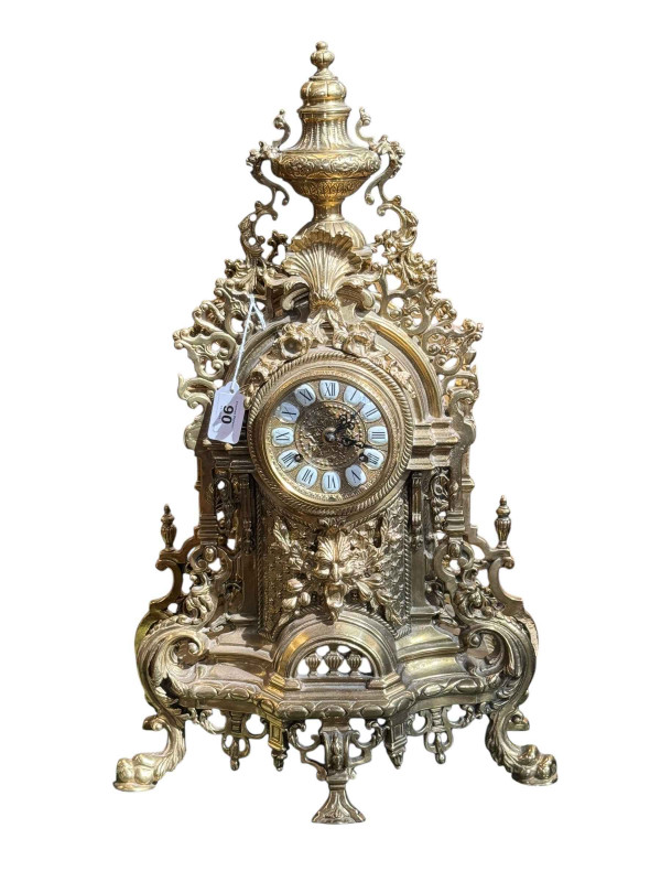 Ornate brass chiming mantel clock with enamel numerals, 62cm.