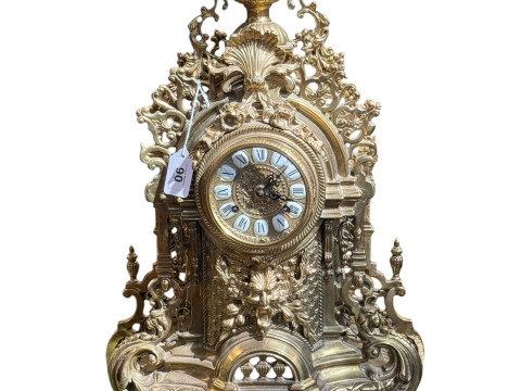 Ornate brass chiming mantel clock with enamel numerals, 62cm.