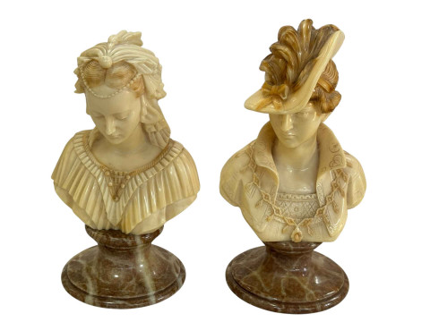 Pair of busts on composite bases, 25cm.