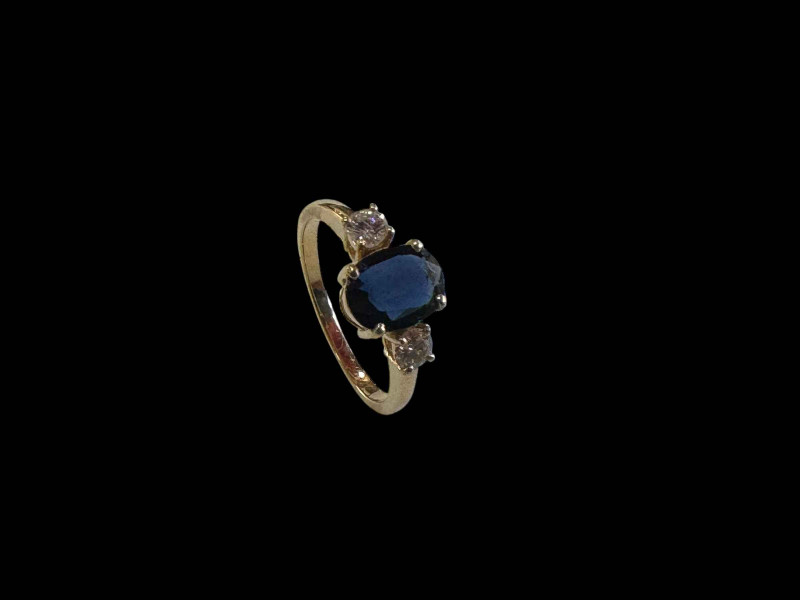 Three stone sapphire and diamond ring, set in 18 carat yellow gold, size M.