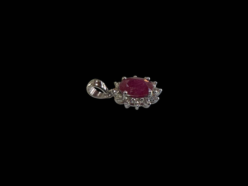 18 carat white gold ruby and diamond cluster pendant.