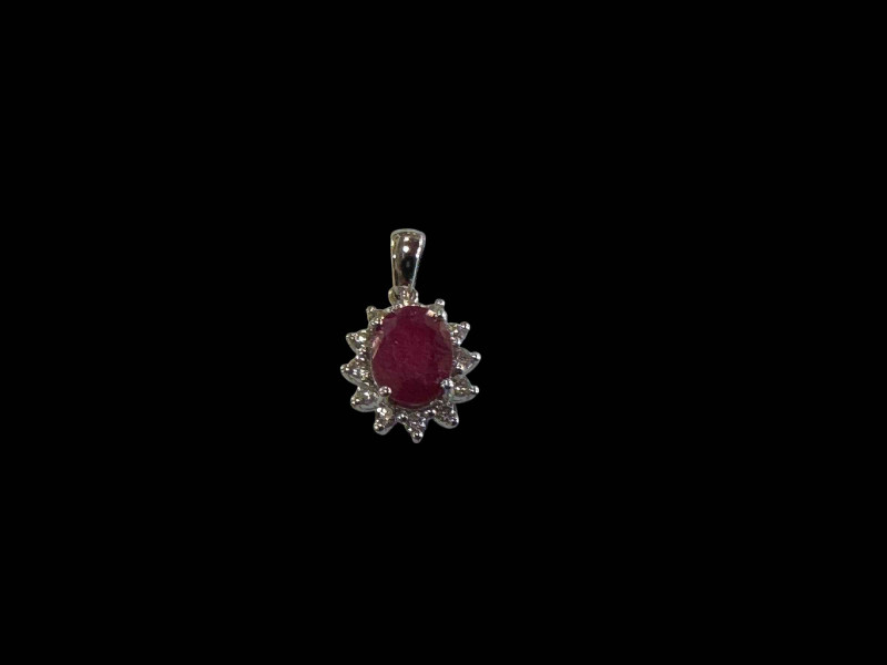 18 carat white gold ruby and diamond cluster pendant.