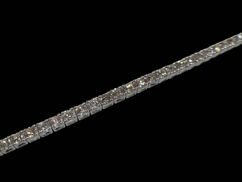 18 carat white gold and diamond tennis bracelet, total diamond content over 5 carats. thumbnail
