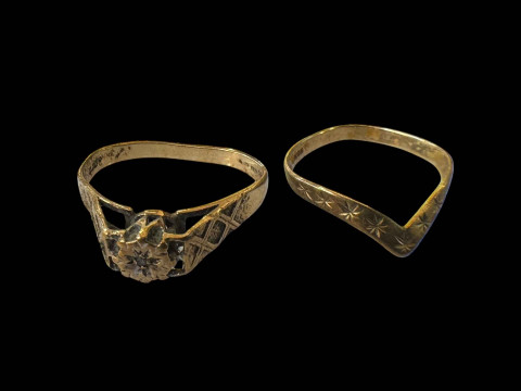 Two 9 carat gold rings, gem set and wishbone.