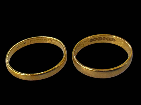 Two 22 carat gold wedding bands.