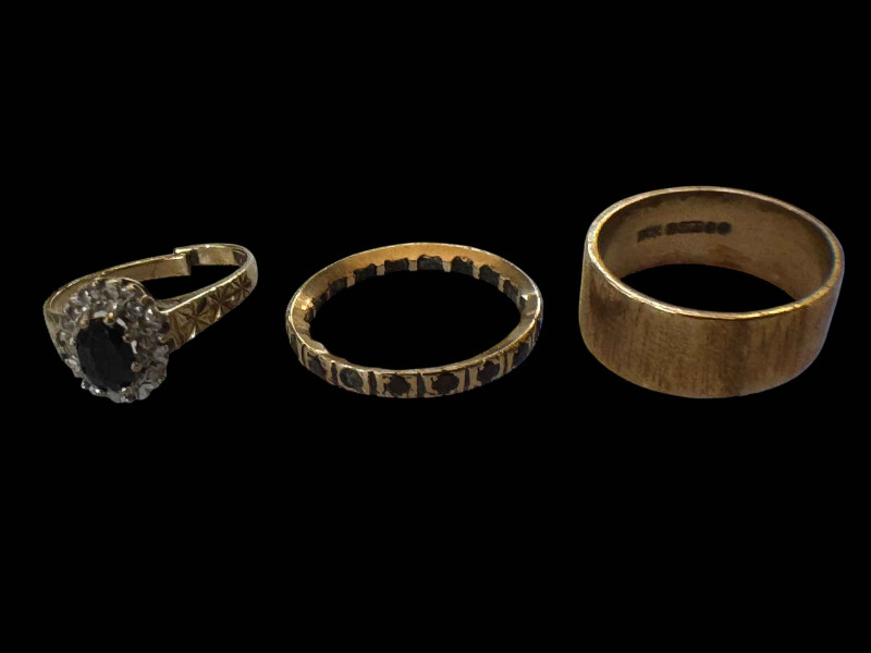 9 carat gold wedding band, 9 carat gem set ring and garnet eternity ring (3).