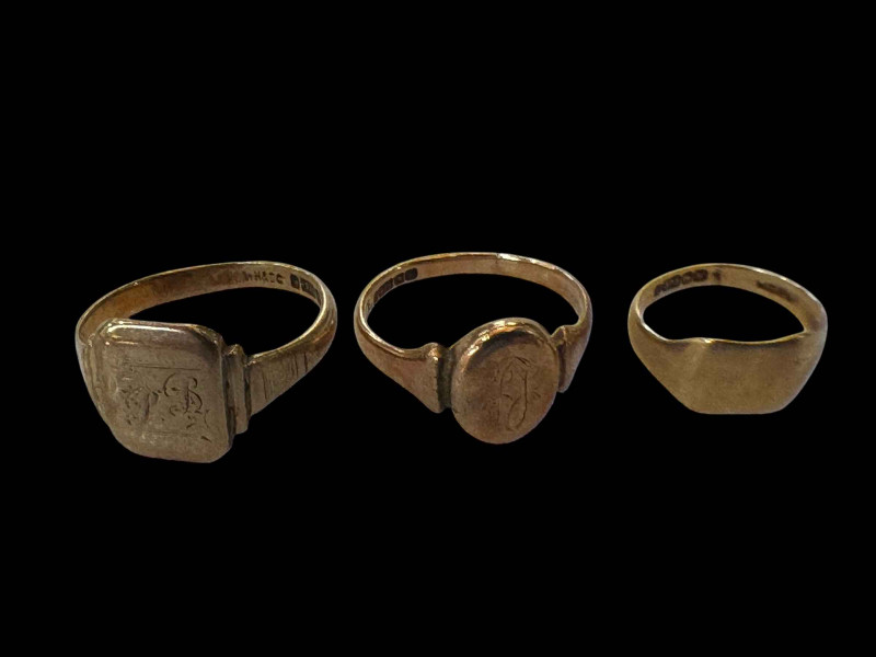 Three 9 carat gold rings.