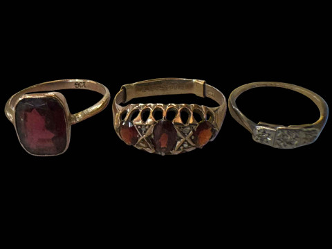 Three 9 carat gold gem set rings.