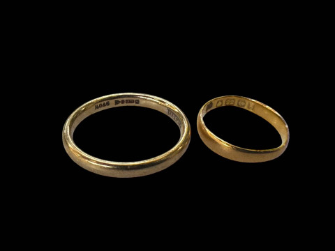 22 carat and 9 carat gold band rings (2).