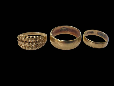 Three 9 carat gold rings.