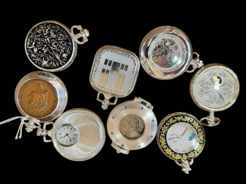 Eight top winding pocket watches.