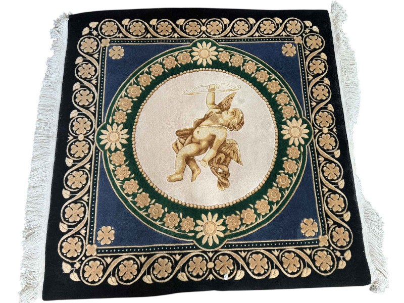 Vietnamese rug decorated with cherub medallion, 1.20m by 1.20m.