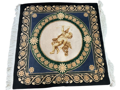 Vietnamese rug decorated with cherub medallion, 1.20m by 1.20m.