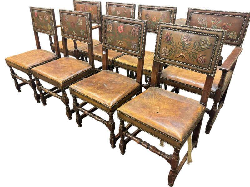 Set of eight oak floral painted hide and studded dining chairs including pair carvers.