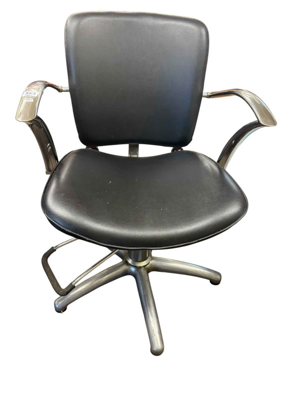 Adjustable chrome and black leather? Barbers chair.