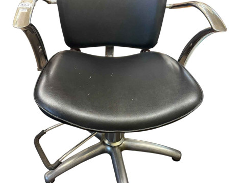 Adjustable chrome and black leather? Barbers chair.
