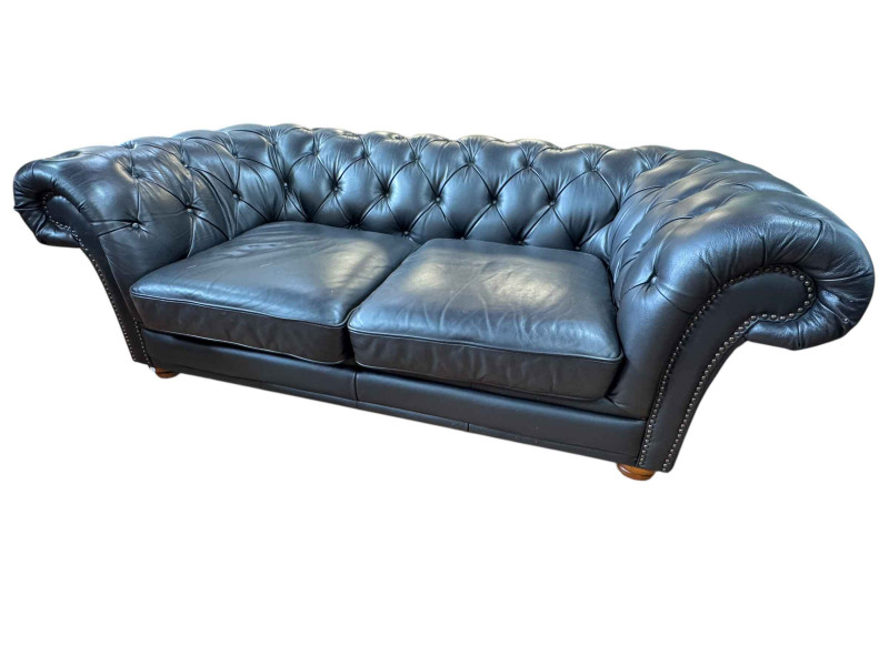 Black buttoned leather and studded two seater Chesterfield settee, 67cm by 201cm by 101cm.