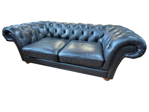 Black buttoned leather and studded two seater Chesterfield settee, 67cm...
