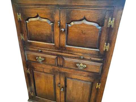 Titchmarsh & Goodwin? oak four door drinks cabinet having slide above...