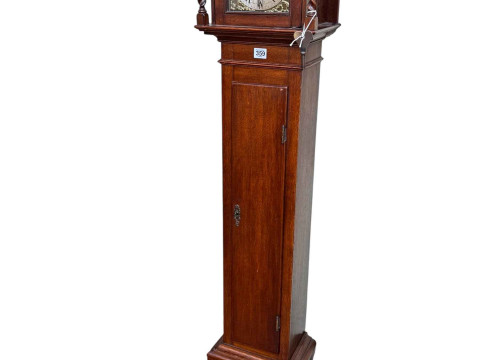 Jacobean style oak 8-day grandmother clock having engraved brass dial...