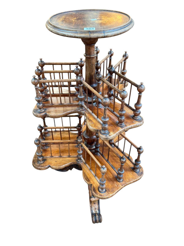 Victorian walnut revolving twelve-division graduated Canterbury/book stand on triform base, 90.5cm.