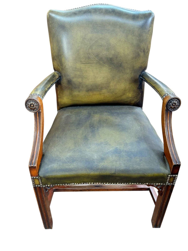 Green leather and studded Gainsborough style chair.