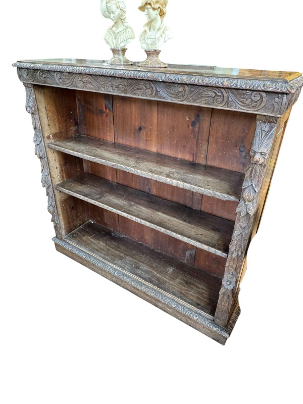 Victorian carved oak open bookcase having two adjustable shelves, 115cm by 120cm by 31cm.