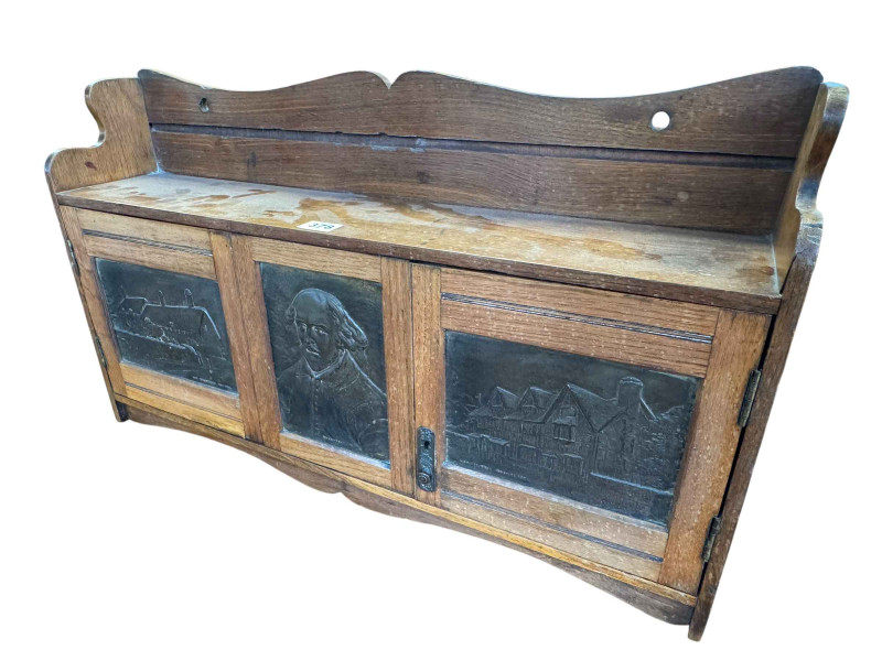 Arts and Crafts oak wall cabinet having triple Shakespearian panel front, 40cm by 67cm by 14.5cm.