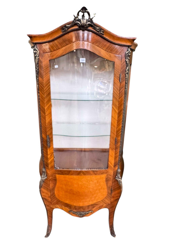 Continental walnut and brass mounted serpentine front vitrine, 177cm by 86.5cm by 47cm.
