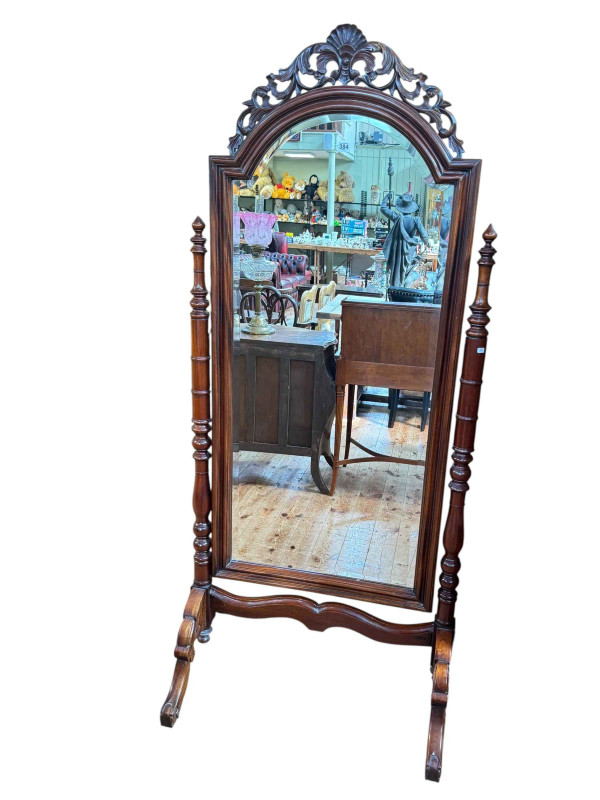 Mahogany arched top bevelled cheval mirror with turned supports, 186cm by 82cm.