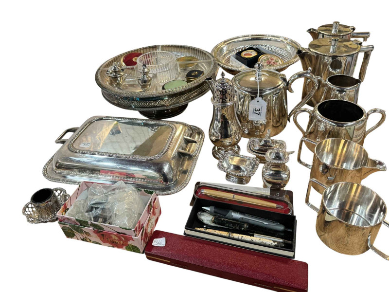 Collection of silver plated wares including candlesticks, pens, coins, compacts, etc.