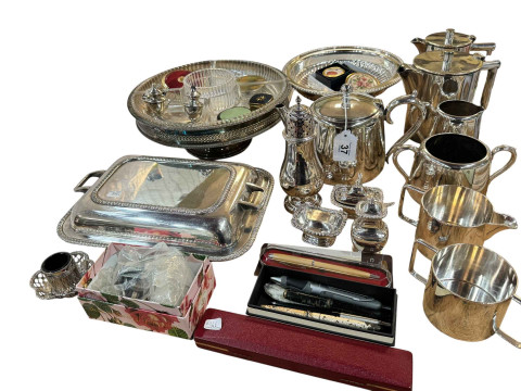 Collection of silver plated wares including candlesticks, pens, coins,...
