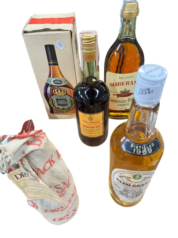 Collection of alcohol including Glen Grant Malt Whisky 1969, Soberano Brandy, Juan Carlos Brandy, etc.