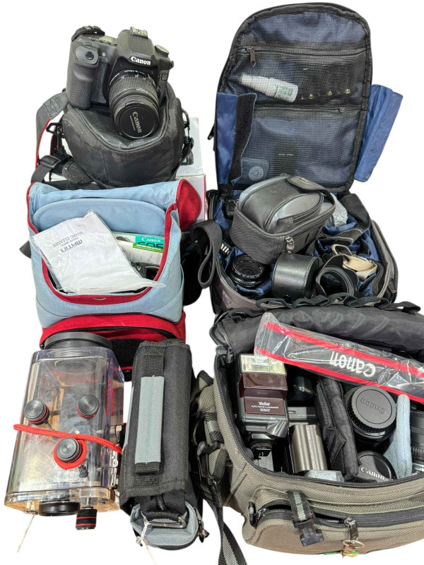 Collection of cameras, lenses and carry cases including Canon, Vivitar, Ikelite Digital, etc.