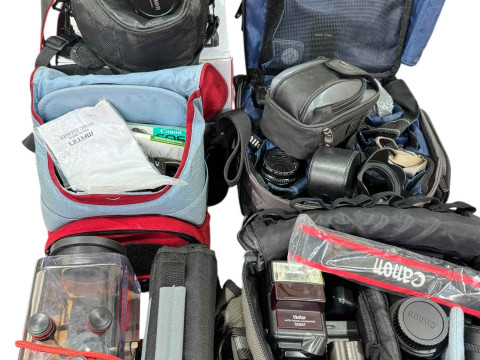 Collection of cameras, lenses and carry cases including Canon, Vivitar,...