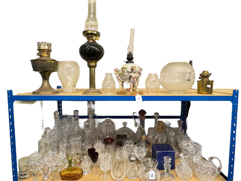 Collection of crystal and oil lamps including decanters, Royal Doulton, etc.