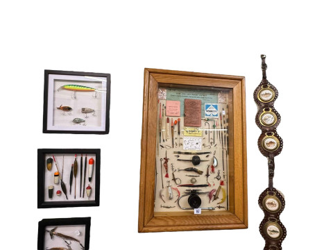 Framed novelty fishing memorabilia, fish horse brasses, etc.