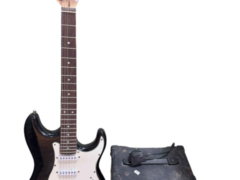 Electric guitar marked C Giant with amp.