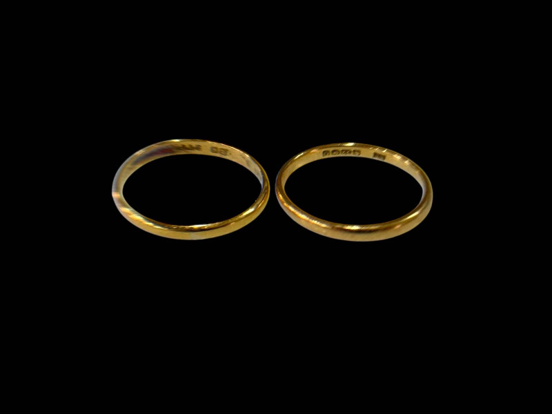 Two 22 carat gold band rings.