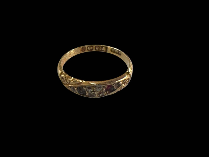 18 carat gold gem set ring.