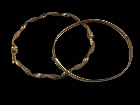 Two 9 carat gold bangles.