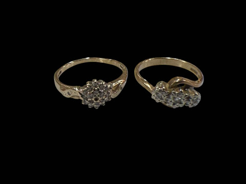 Two 9 carat gold diamond set rings.