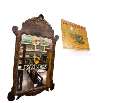 Walnut framed pier mirror painted 'Rolex', and Excursion Washer advert...