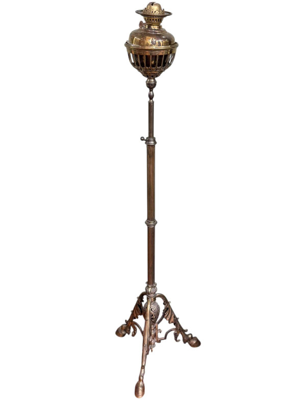 Brass telescopic standard oil lamp on triform base.